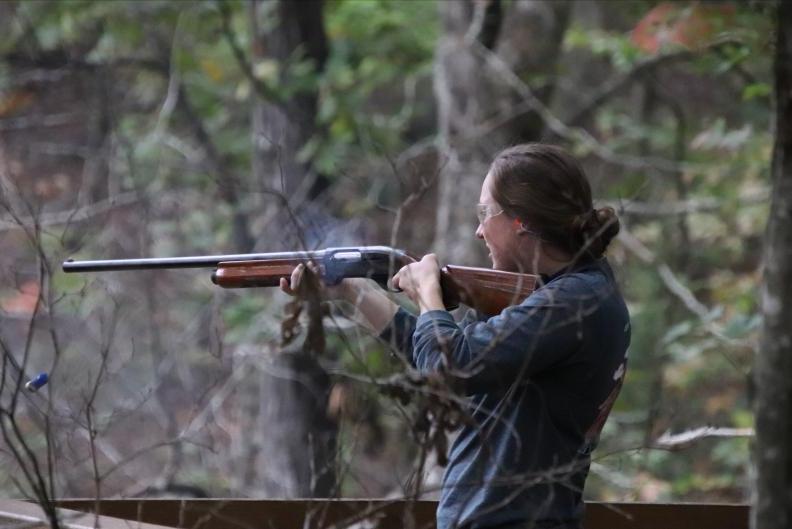 Woman shooting a gun